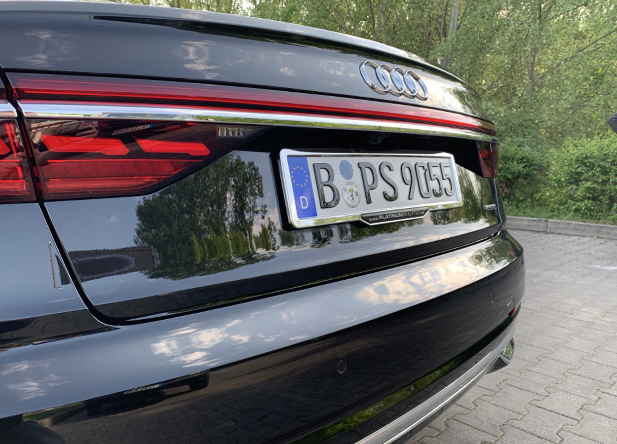 AD8321539 PRASCO Kennzeichenhalter vorne, schwarz, rahmenlos für Audi Q7 4L  ▷ AUTODOC Preis und Erfahrung